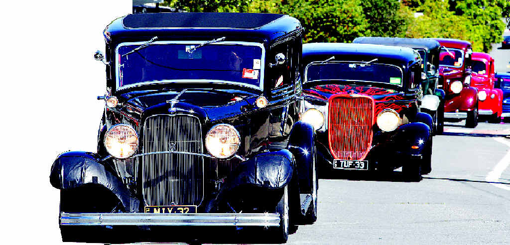 Procession of hot rods for Brett Bowley at Murwillumbah yesterday.